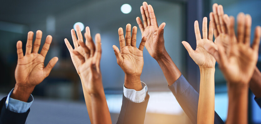 Professionals raising their hands